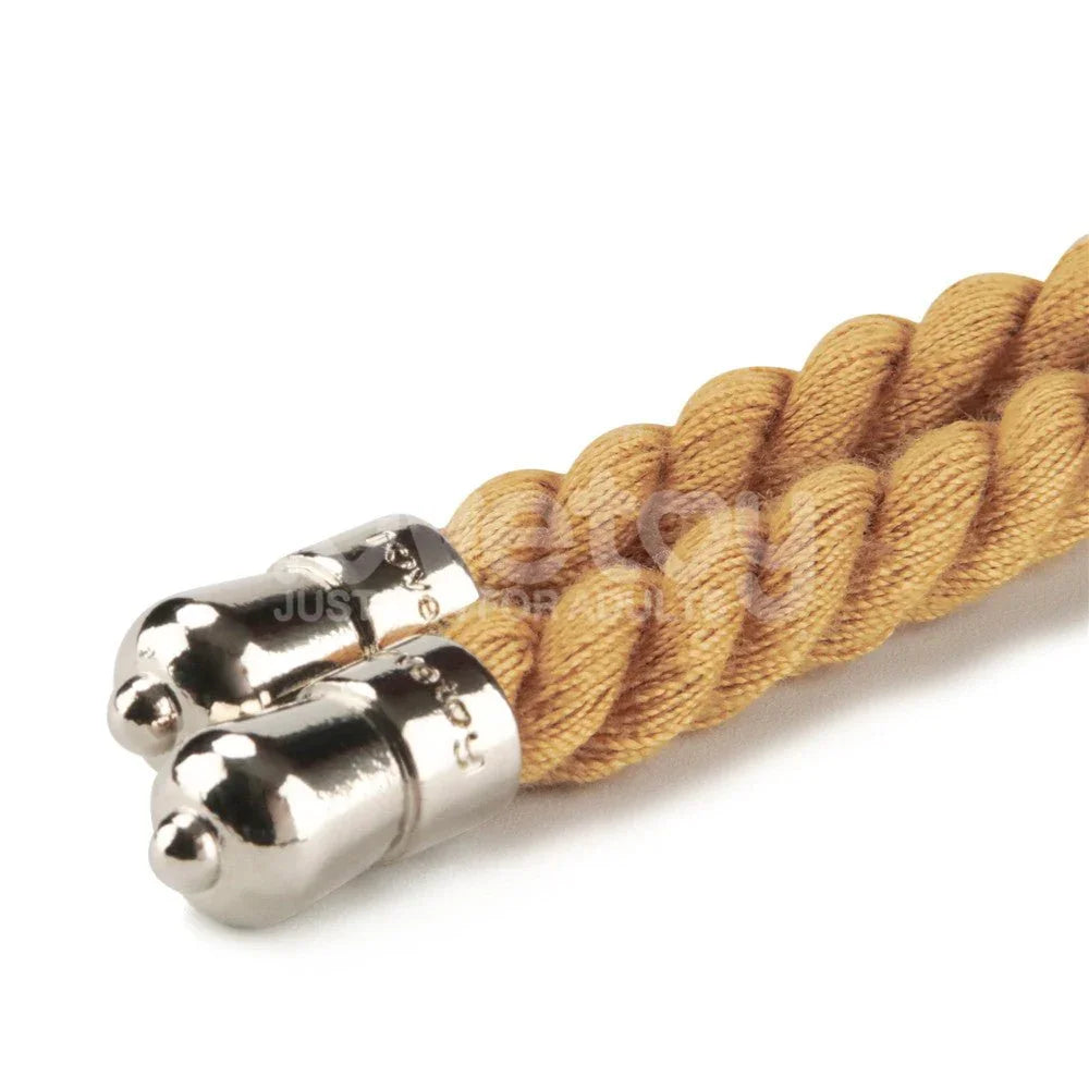 Close-up of the metal end caps on the natural coloured bondage rope
