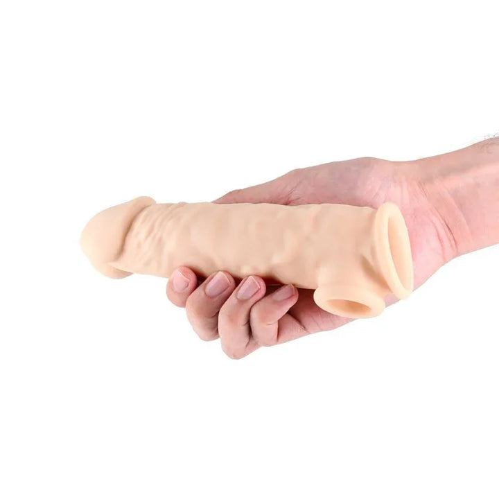 Renegade Annex Thick sleeve in Flesh worn over a closed hand, showing its girth