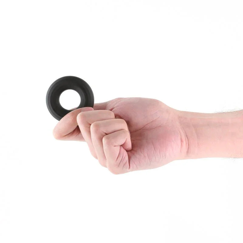 Renegade Fireman Ring in Black balanced on a fingertip, showing its scale