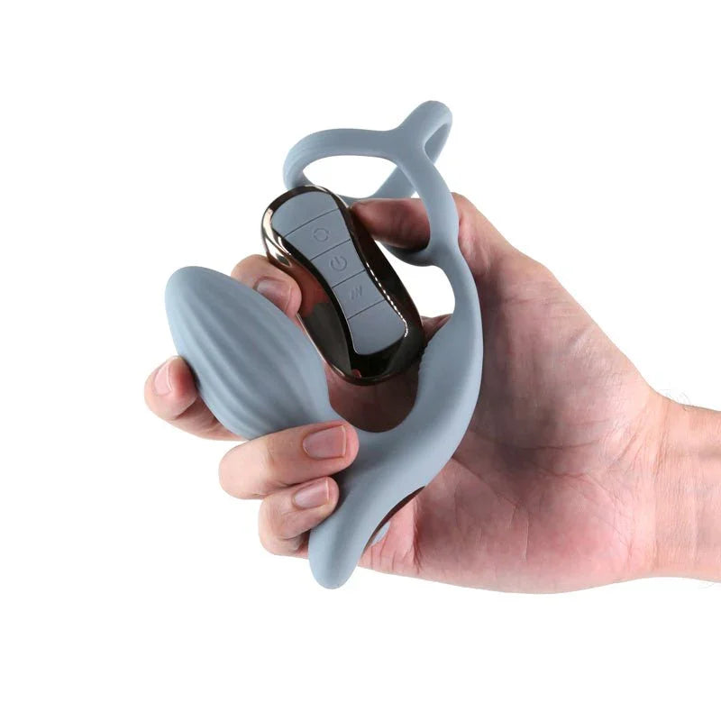 Renegade Pinnacle in Grey gripped in a hand with its remote, showing the scale
