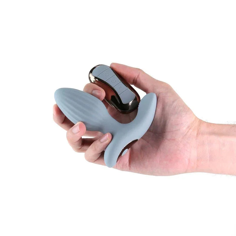Renegade Summit in Grey gripped in a hand with its remote, showing the scale