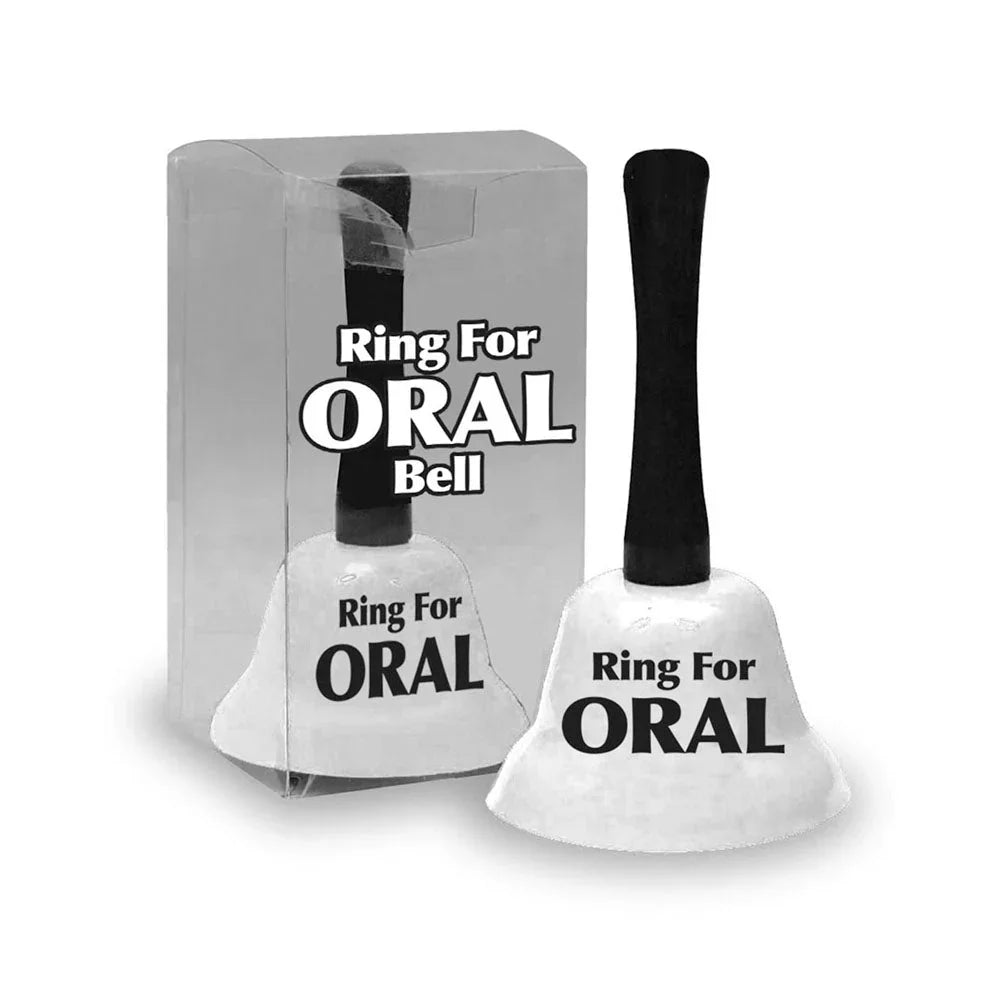 Ring For Oral novelty desk bell in White with a black handle, beside its clear pack