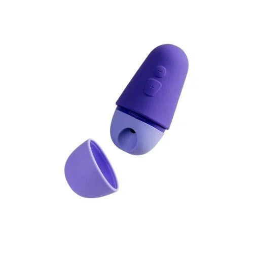Romp Free X clitoral suction stimulator in Purple, cap removed beside it