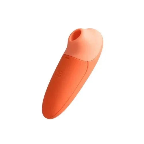 Romp Switch X clitoral suction stimulator in Orange, angled profile