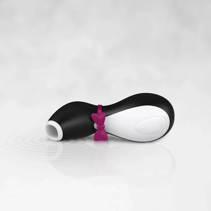 Satisfyer Penguin lying on a pale surface, showing its size