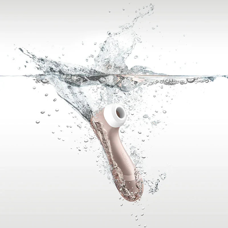 Satisfyer Pro 2 in rose gold splashing into water, waterproof