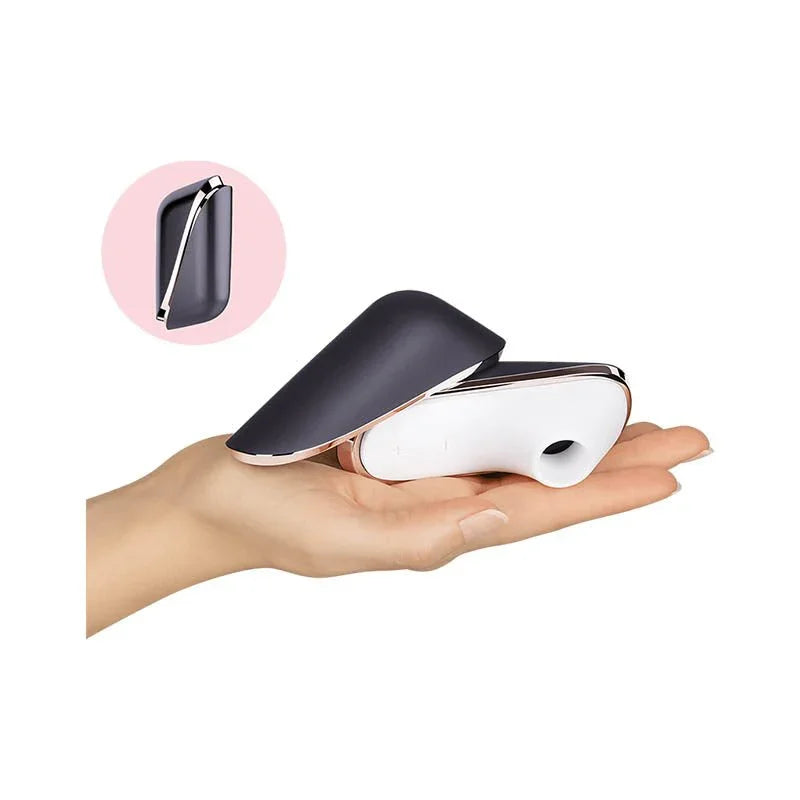 Satisfyer Pro Traveller held in a hand to show its compact size