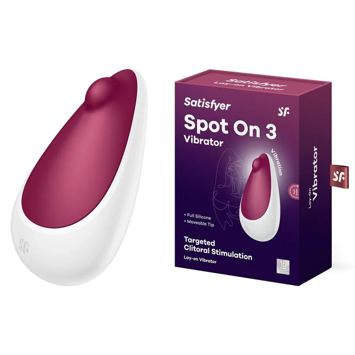 Satisfyer Spot On 3 Clitoral Stimulator in Berry beside its retail box