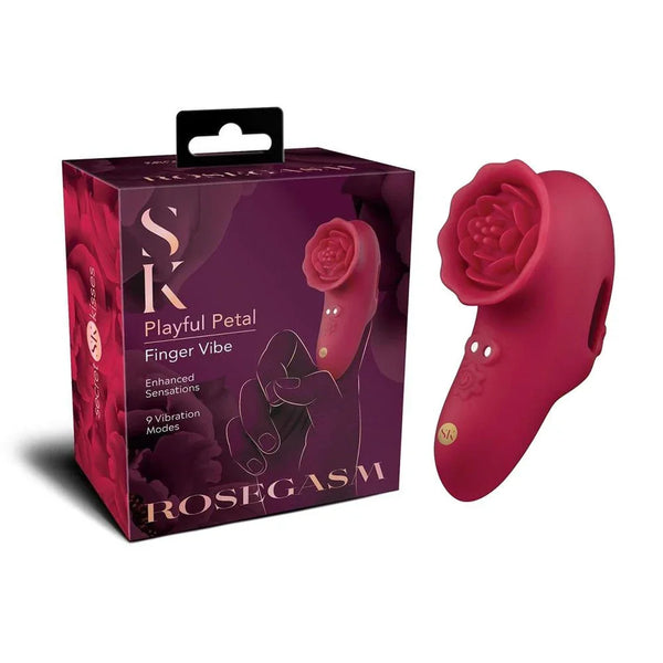 Secret Kisses Rosegasm Playful Petal Finger Vibe in Red beside its plum retail box