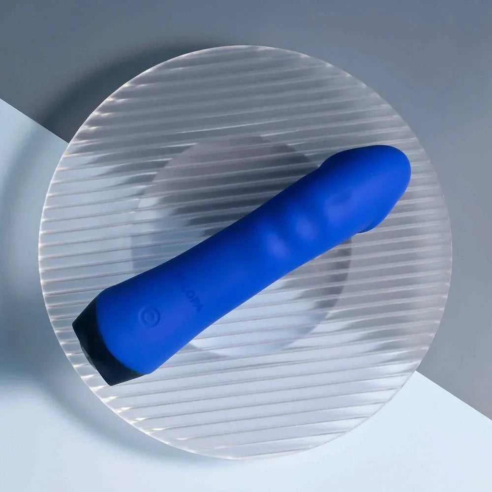 Blue Banger on a glass disc, base button and tapered tip in view