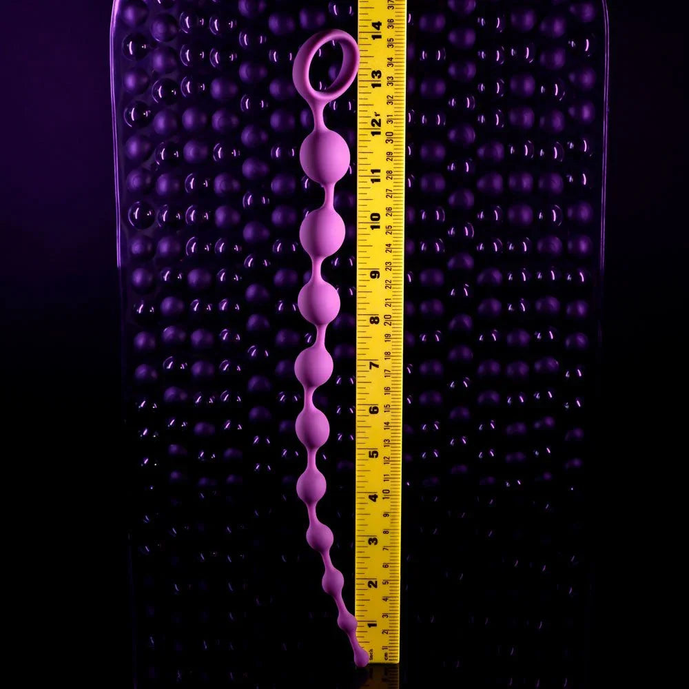 Beaded Adventure stood beside a ruler to show its 35.5 cm length