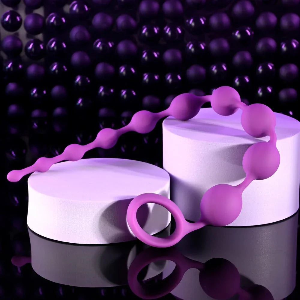Beaded Adventure curved over white plinths with the pull ring resting below