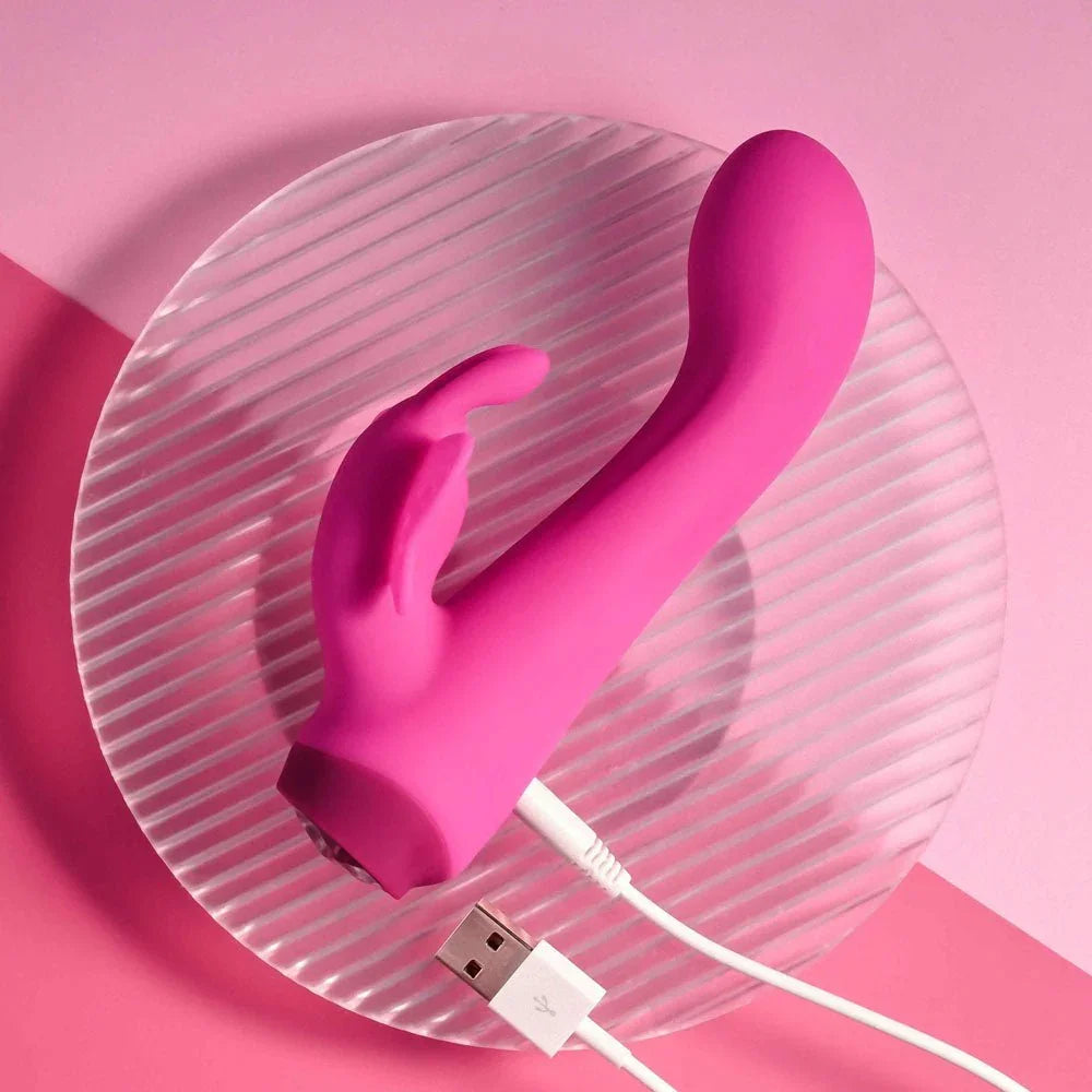 Butterfly Love with its USB charging cable connected at the base