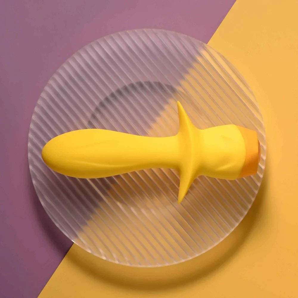 Mellow Yellow lying on a glass disc with the tapered tip to the left