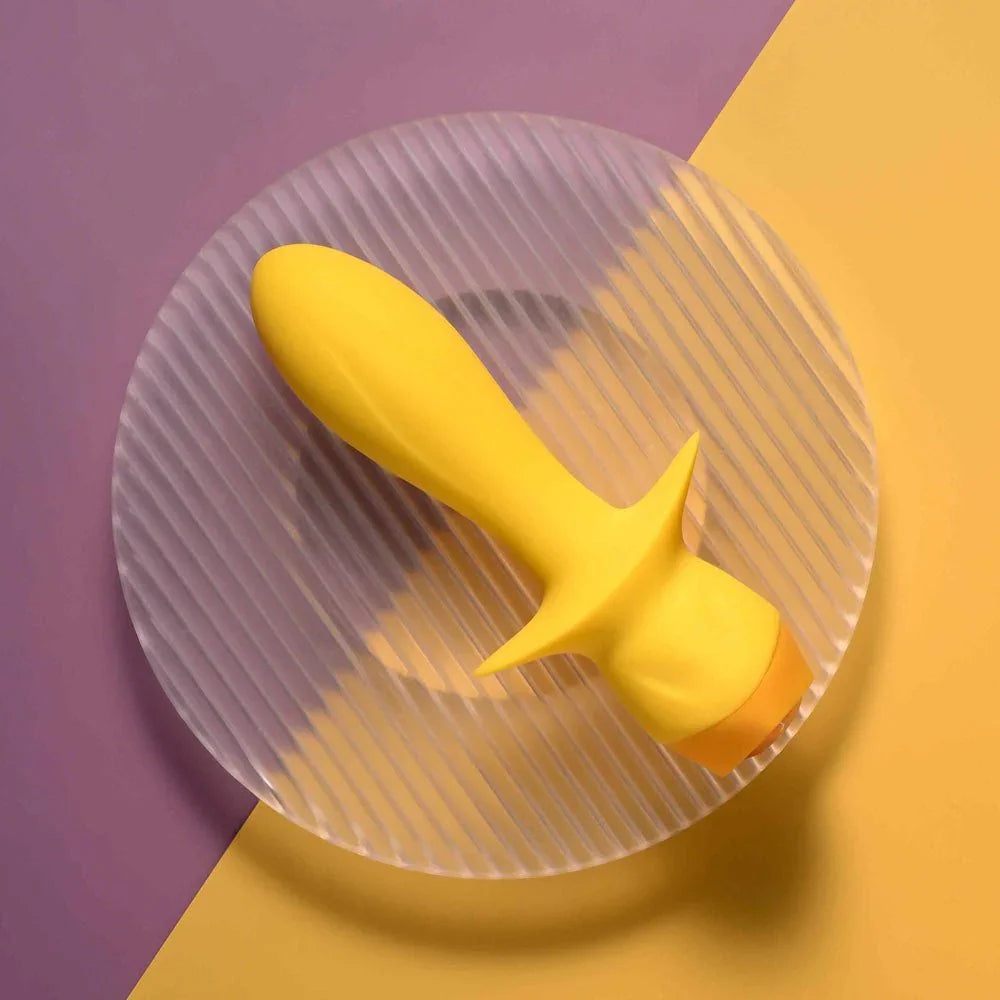 Mellow Yellow plug on a ribbed glass disc, flared base at the lower right