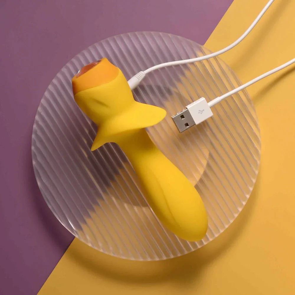 Mellow Yellow with its USB charging cable connected at the base