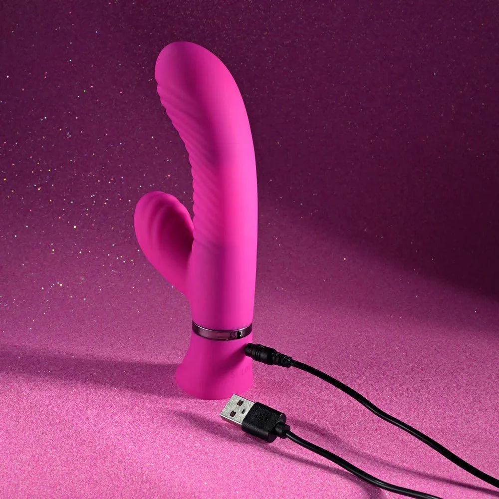 Next Wave with its USB charging cable connected at the base