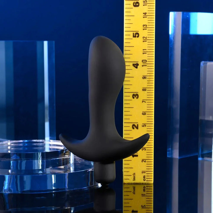 P-Spot Trainer stood beside a ruler to show its 12.7 cm length