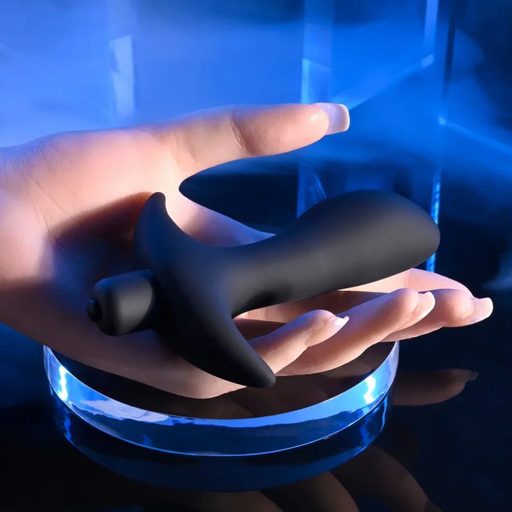 P-Spot Trainer resting on a hand to show its size