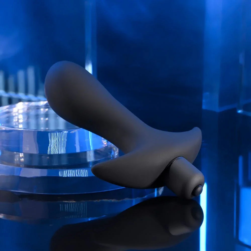 P-Spot Trainer angled on a clear riser, curved shaft and flared base