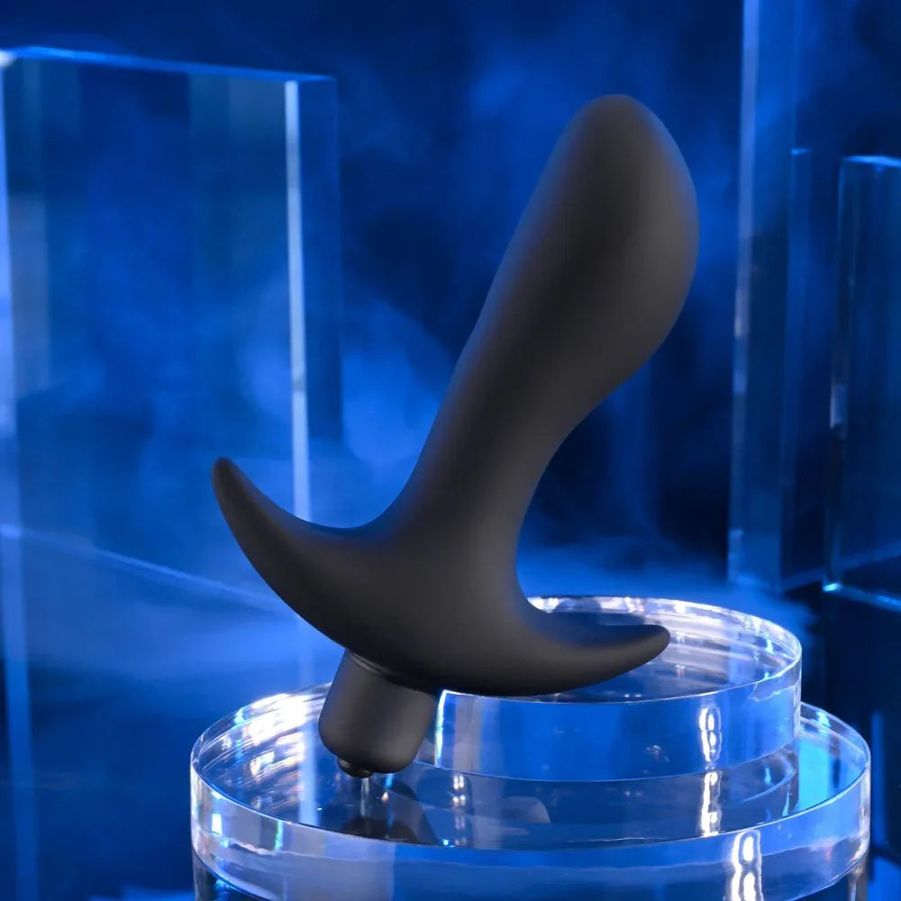 P-Spot Trainer standing on a clear disc under blue lighting