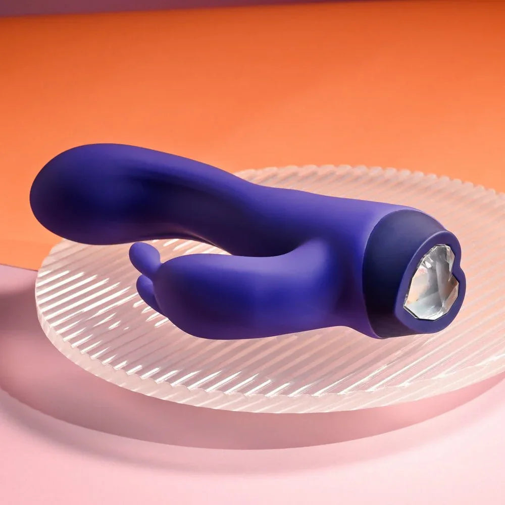 Plum Job lying down with the heart-shaped gem base button facing the camera