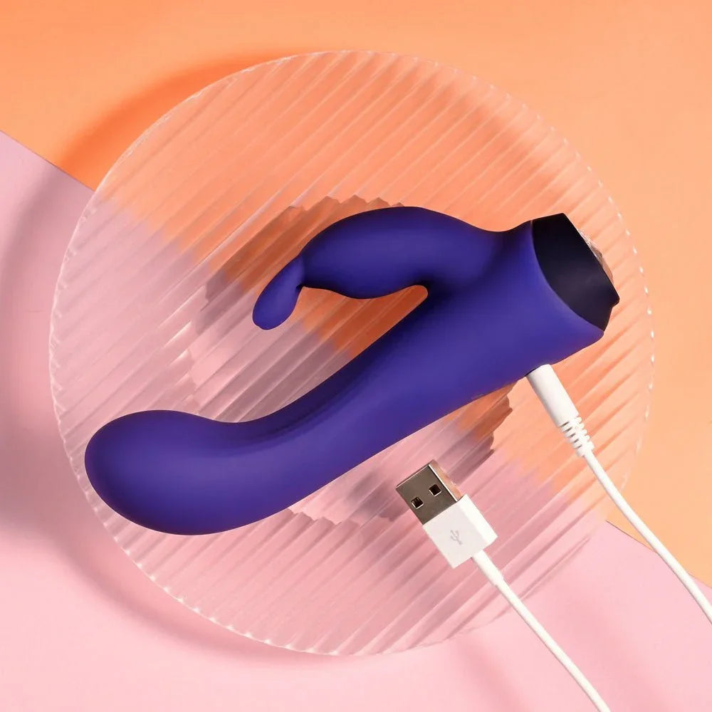 Plum Job with its USB charging cable connected at the base