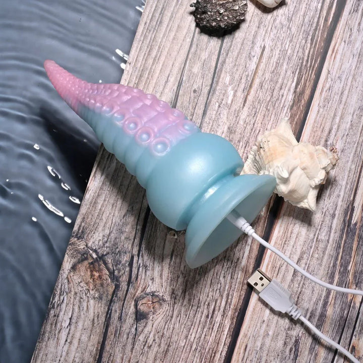 Stuck On You lying down with the charging cable connected at the suction base