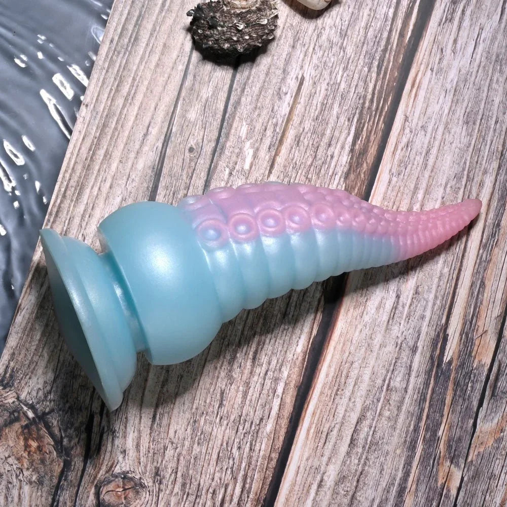 Stuck On You lying on its side with the pink tentacle tip to the right