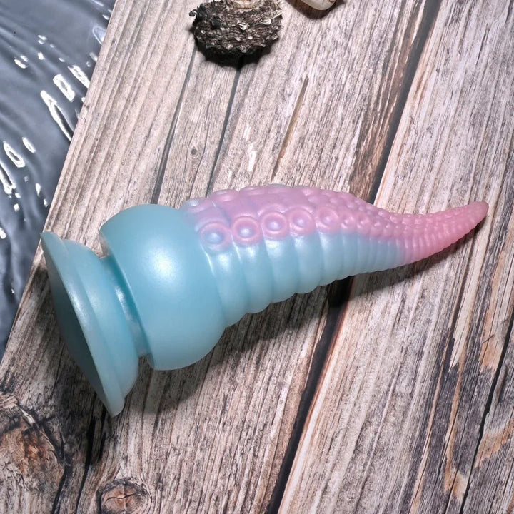 Stuck On You lying on its side with the pink tentacle tip to the right