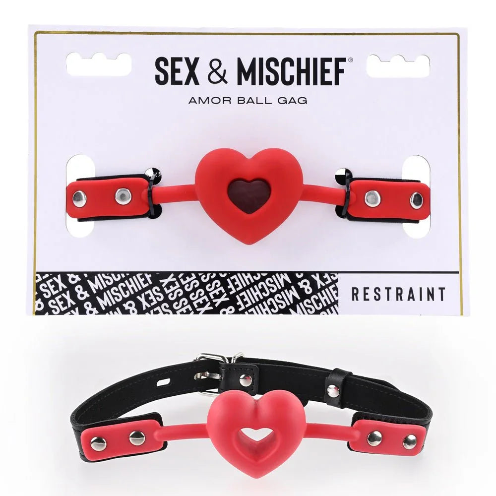 Sex & Mischief Amor Ball Gag on its card, red heart-shaped gag with black strap