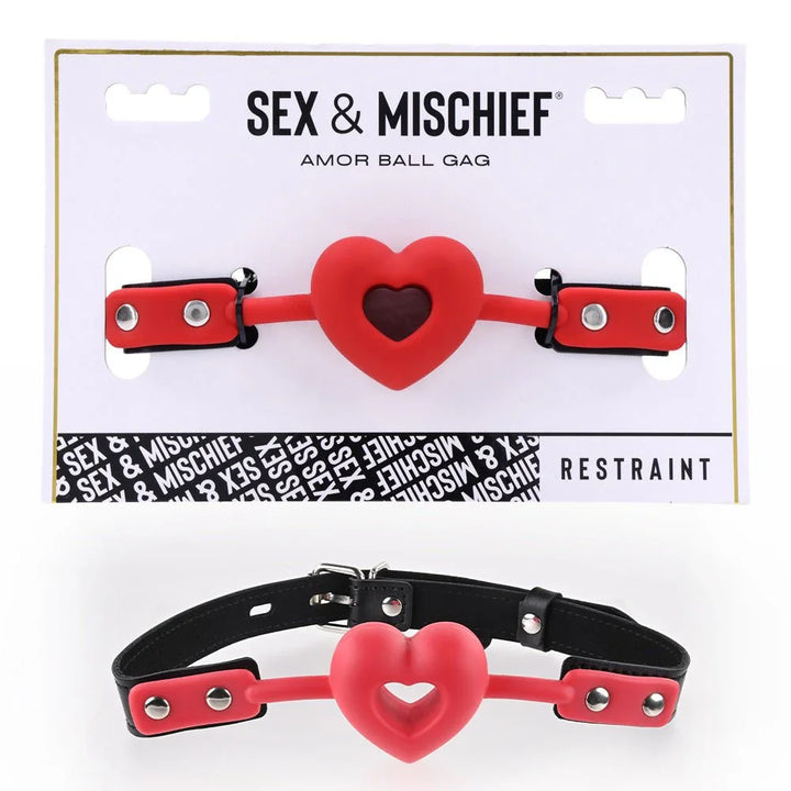 Sex & Mischief Amor Ball Gag on its card, red heart-shaped gag with black strap