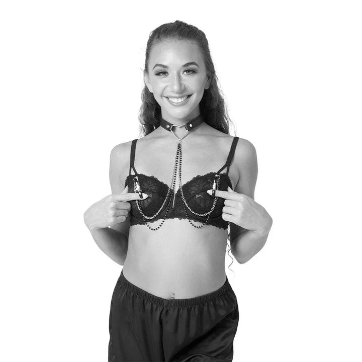 Model wearing the Amor collar with the beaded chains and nipple clamps attached