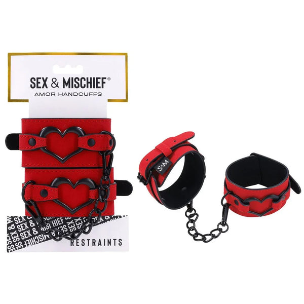 Sex & Mischief Amor Handcuffs on their card, red cuffs with black heart detail