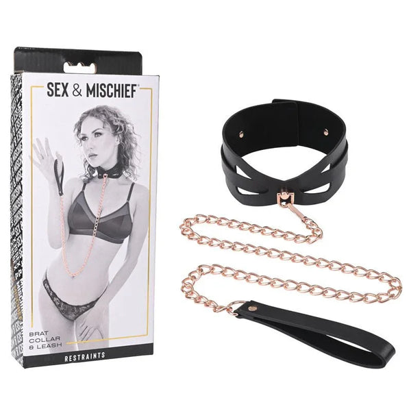Sex & Mischief Brat Collar & Leash box beside the black collar and rose gold chain