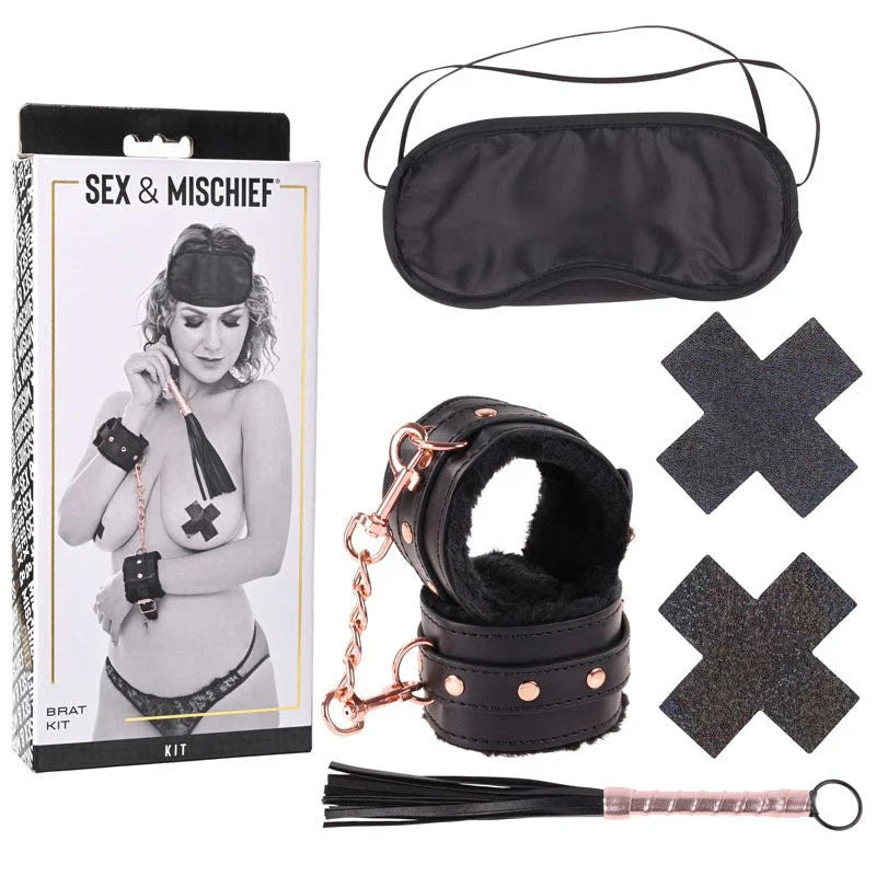 Sex & Mischief Brat Kit box beside the blindfold, fur-lined cuffs, cross pasties and mini flogger