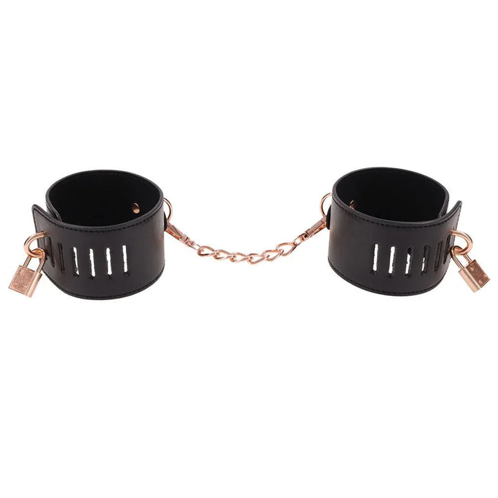 The two Brat locking cuffs joined by the short rose gold chain