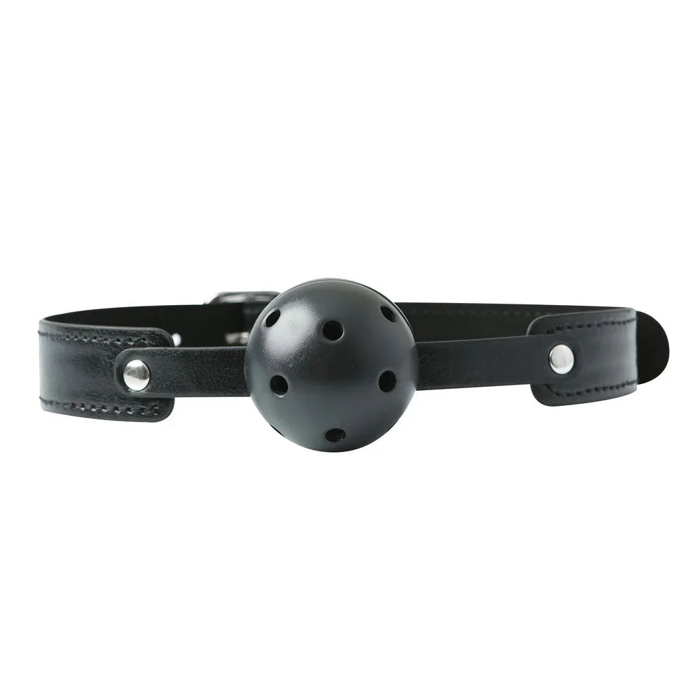 Breathable ball gag laid flat, vented black ball on a black leather strap