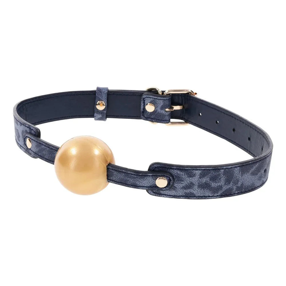 Cougar Ball Gag angled to show the adjustment holes along the navy strap