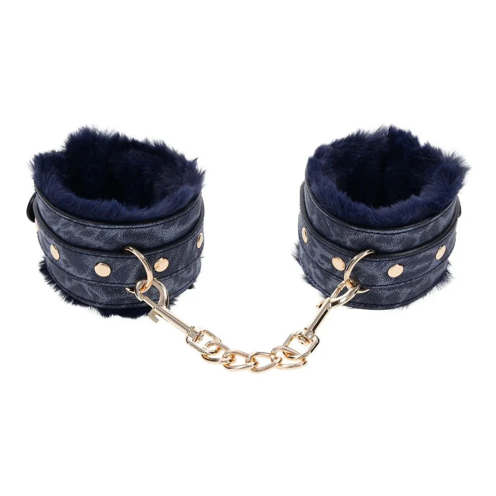Cougar cuffs upright showing the navy fur trim and gold studs