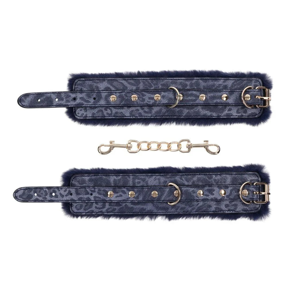 Cougar cuffs laid open with the gold chain and swivel clips below