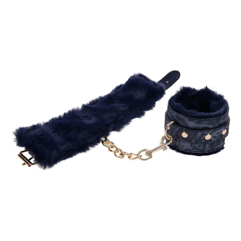 A removable navy fur lining beside one Cougar cuff with its gold chain