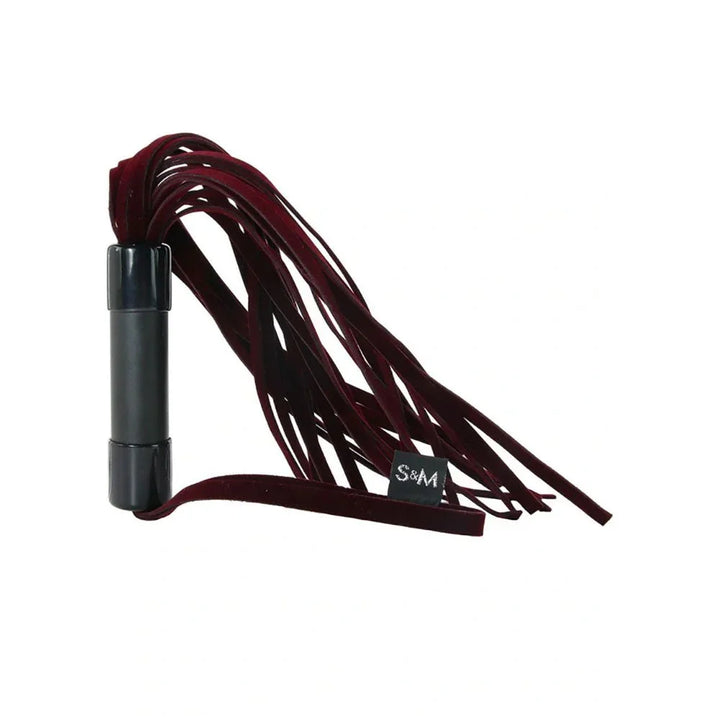 Enchanted Flogger with the burgundy falls arcing back over the black handle