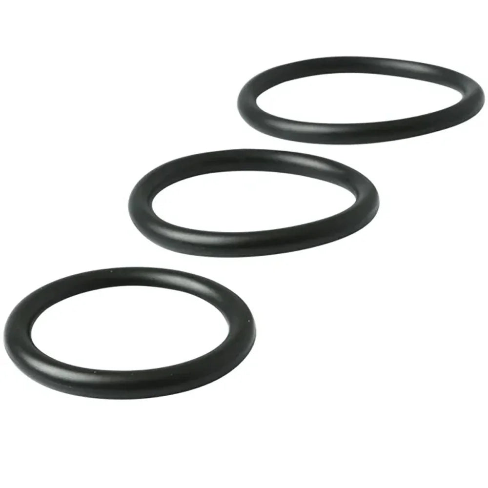 Three black nitrile cock rings laid out in graduating sizes