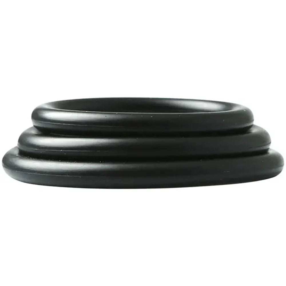 The three nitrile cock rings nested inside each other, seen edge on
