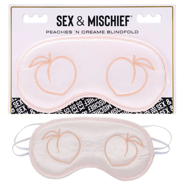Sex & Mischief Peaches 'n Creame Blindfold on its card, peach satin mask with peach motifs