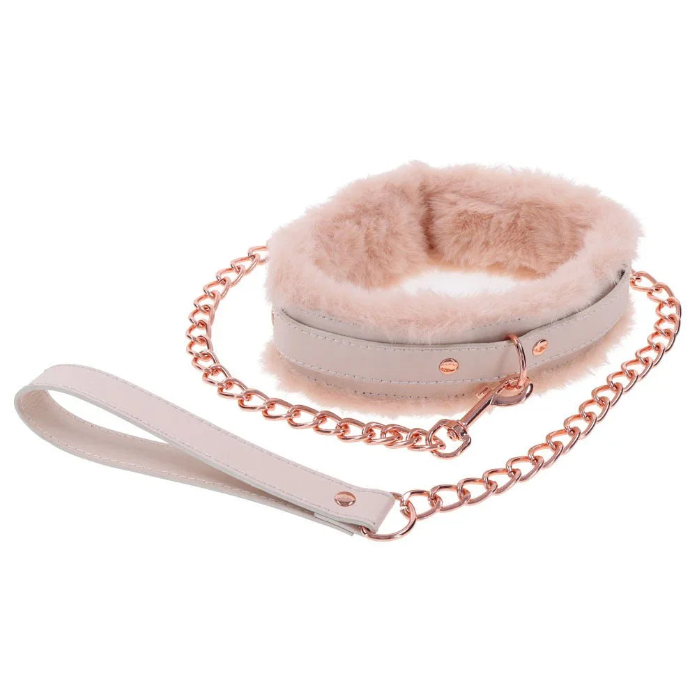 Peach fur collar formed into a ring with the leash handle laid to the side