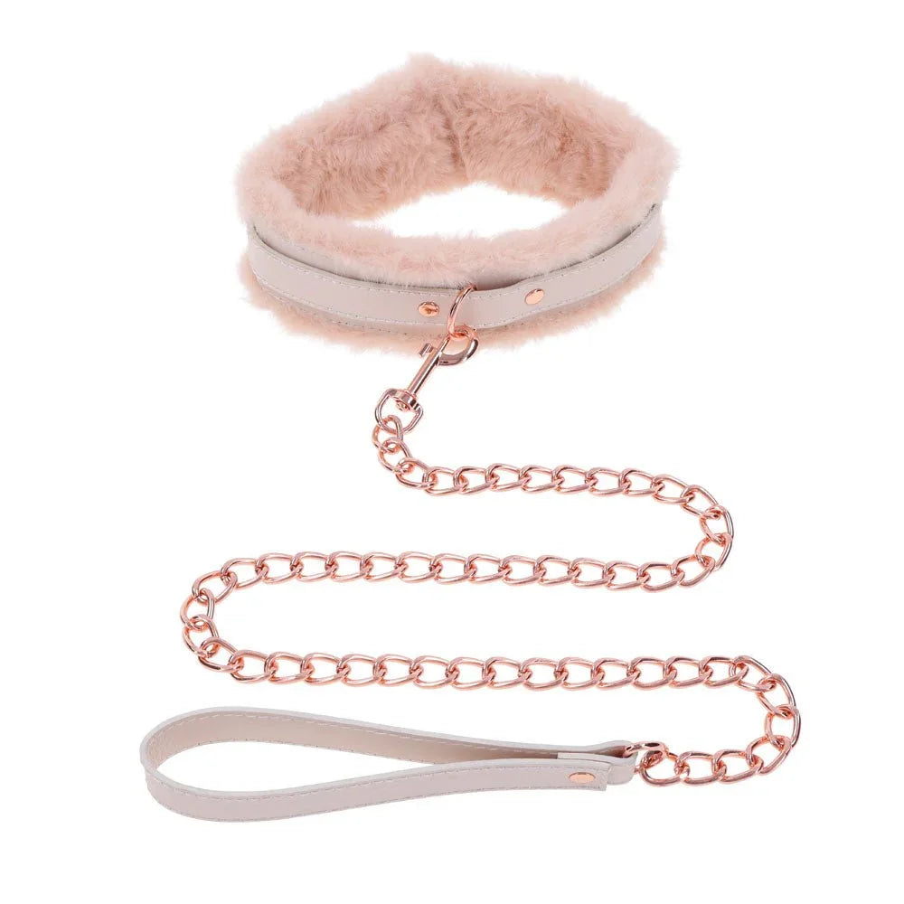 Cream fur-lined collar upright with the rose gold chain leash coiled below