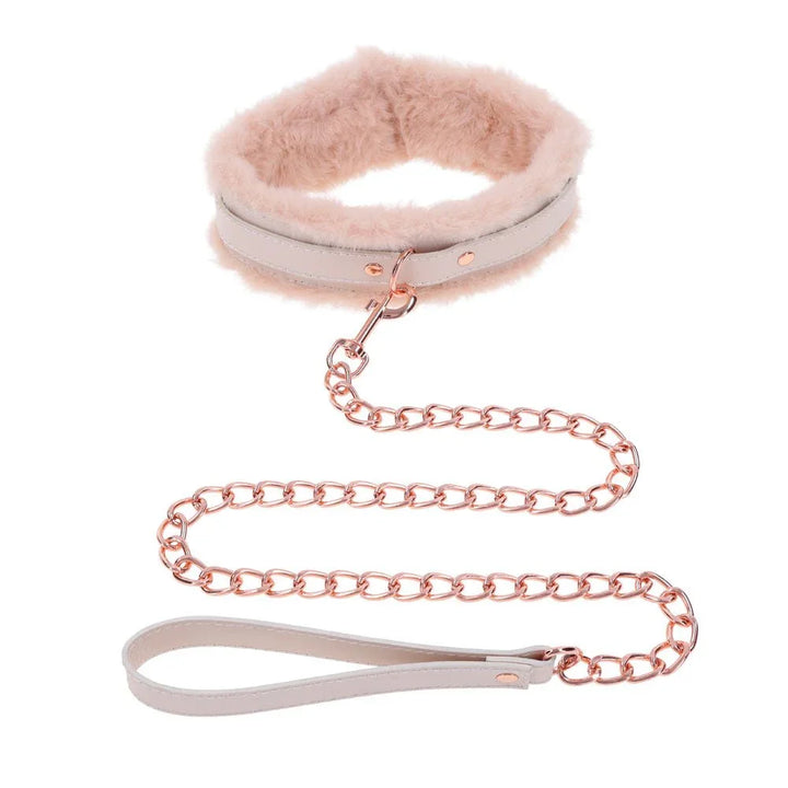 Cream fur-lined collar upright with the rose gold chain leash coiled below