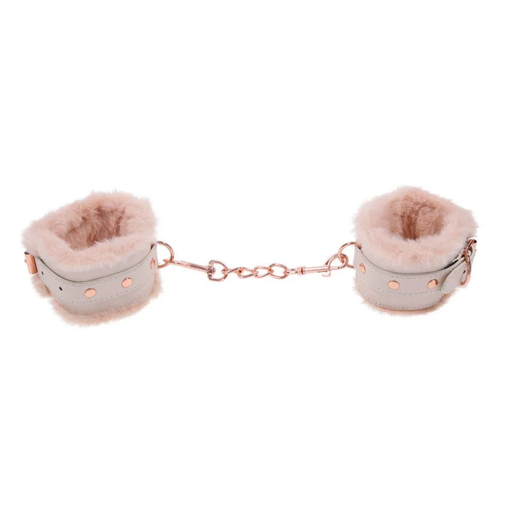 Peaches 'n Creame fur cuffs held apart with the rose gold chain taut